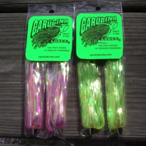 Fishing lures in pink and green packaging.